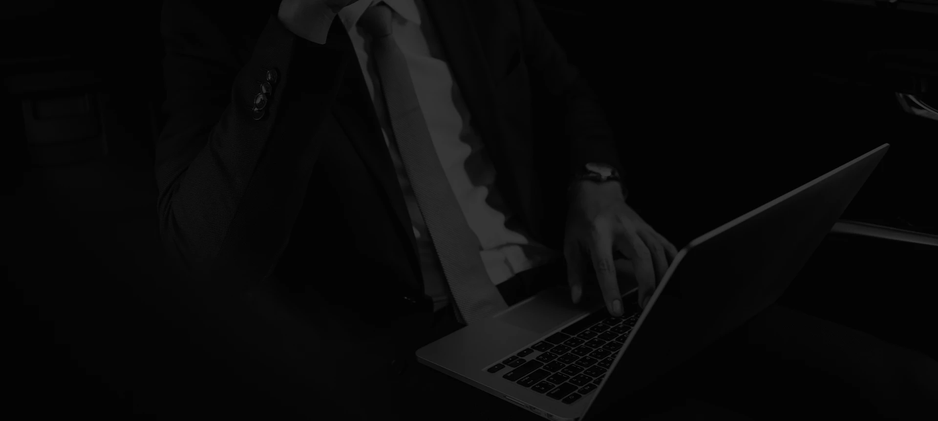 Business executive working on laptop